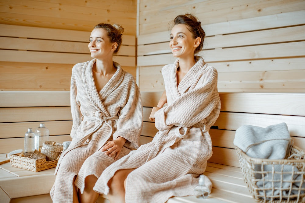 Two women sitting in a sauna